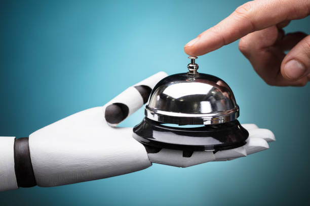 Person Ringing Service Bell Hold By Robot Person's Ringing Service Bell Hold By Robot On Turquoise Background hotel occupation concierge bell service stock pictures, royalty-free photos & images