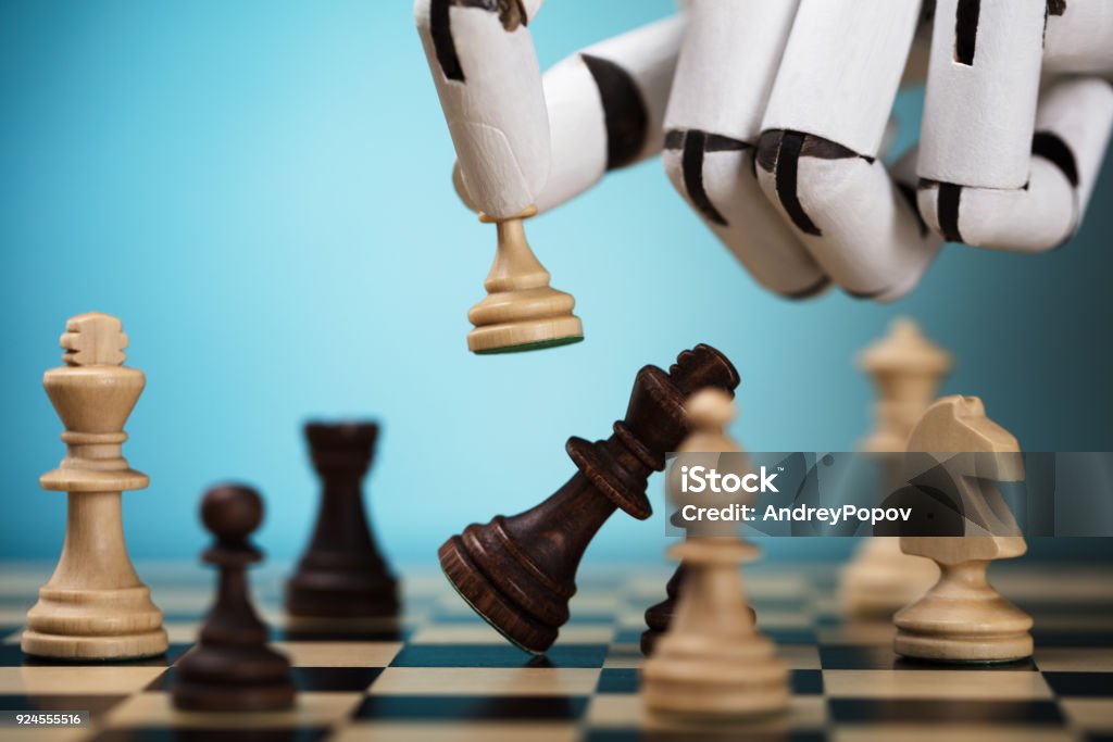 Robot Playing Chess Close-up Of A Robot's Hand Playing Chess Chess Stock Photo