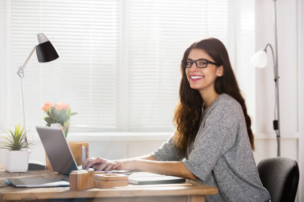 istock Young Happy Woman At Workplace 924558444