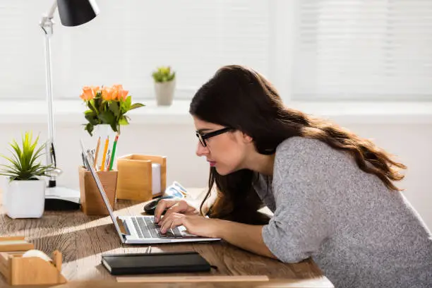 Photo of Businesswoman Sitting In Wrong Posture