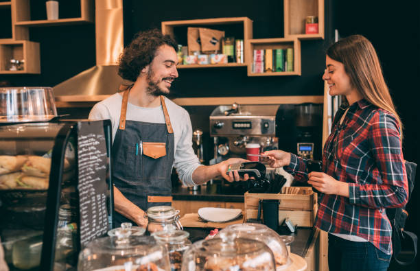 istock Customer paying with a credit card at a coffee shop 924558810