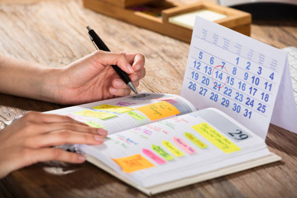 istock Businessperson Writing Schedule In Diary 924558950