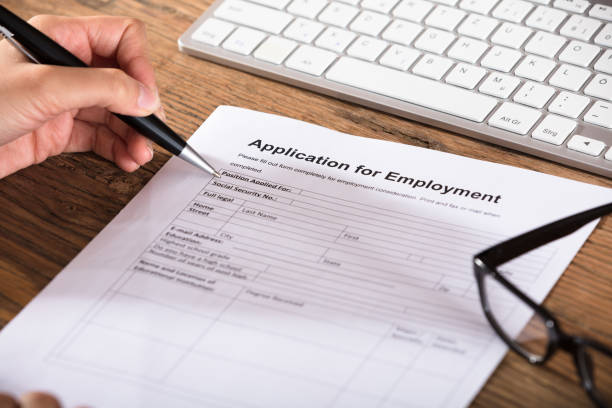 istock Person Filling The Employment Application Form 924559002
