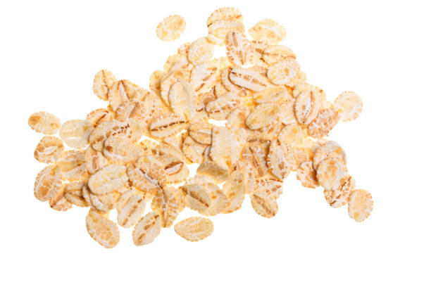 istock oat flakes isolated on white background. Top view 924559364