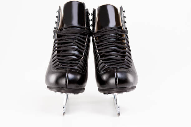 istock Pair of Black Professional Figure skates With Sharp Blades Over White Background 924559522