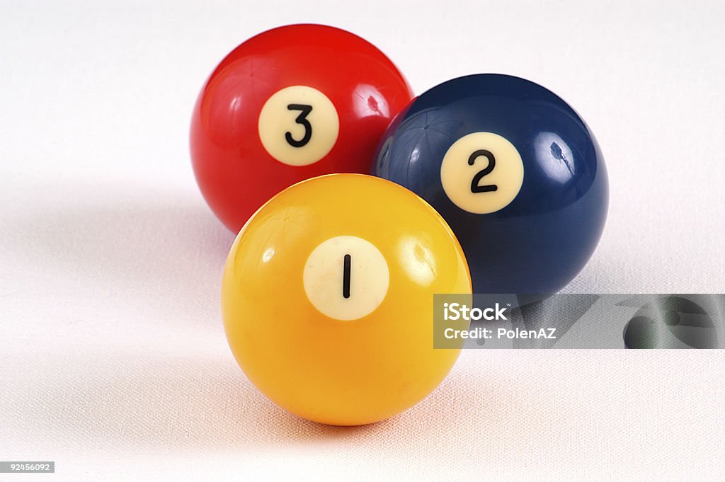 Isolated billiards balls numbered one two and three One, two, and three billiard balls arranged in order. DOF on 1, wide crop to include shadows. Three Objects Stock Photo