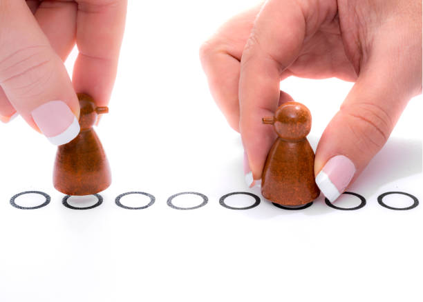 istock Playing board game with pawns with noses 924565640