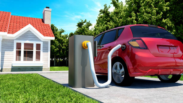 istock Electric car gets power from charging station outside house 924568084