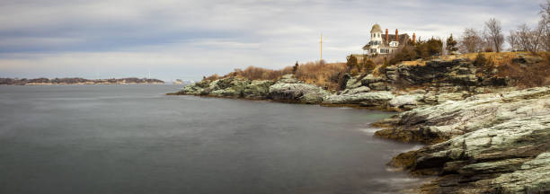 Glacial rock hilltops in the ocean in Monot Beach, Massachusetts.