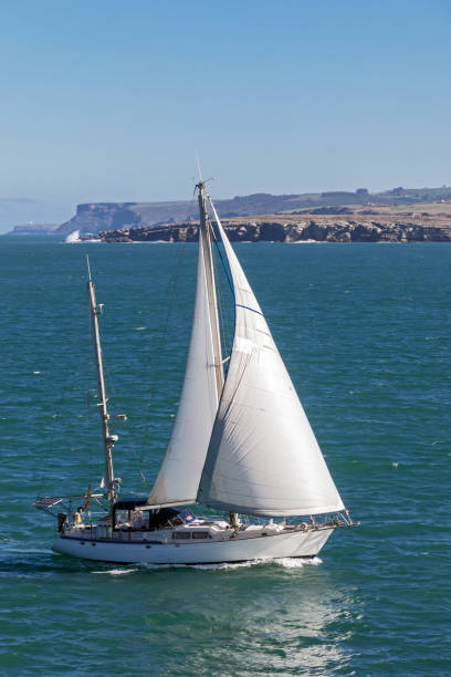 istock White small sailboat at peaceful clear sea scene under sunlight 924572288