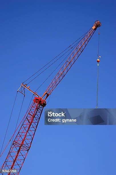 Foto de Guindaste Contra O Céu Azul e mais fotos de stock de Fotografia - Imagem - Fotografia - Imagem, Garra de Guindaste, Guindaste