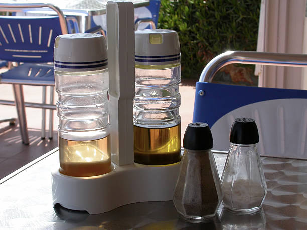 Salt, pepper, oil and vinegar on a cafe table