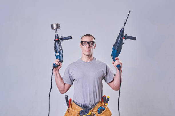 istock Master-Builder-finisher in their working clothes, with two hammers in his hands 924575442