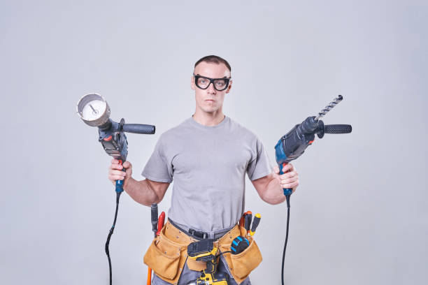 istock Master-Builder-finisher in their working clothes, with two hammers in his hands 924575684