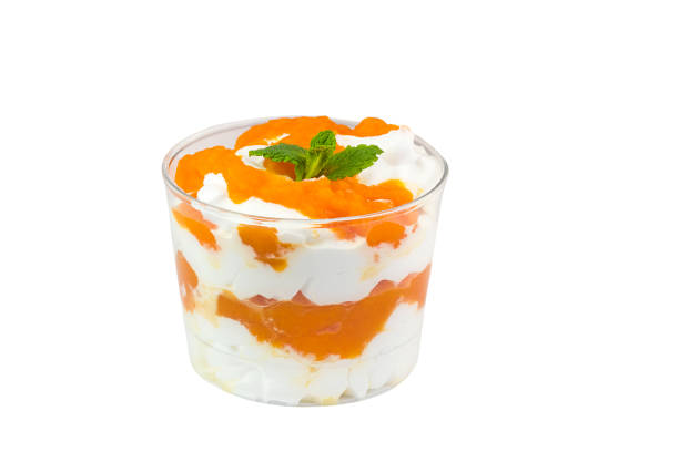 istock Creamy cream dessert in a plastic cup decorated with berries 924579084