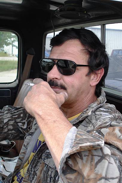 Man smoking in car