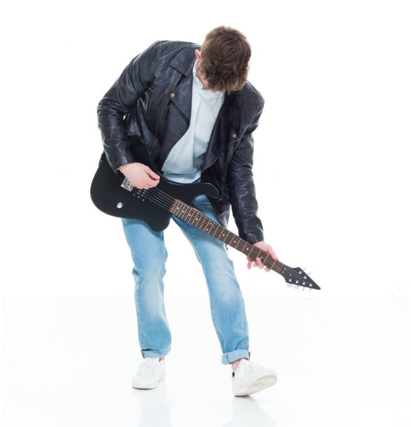 istock Handsome young male playing an electric guitar 924589414