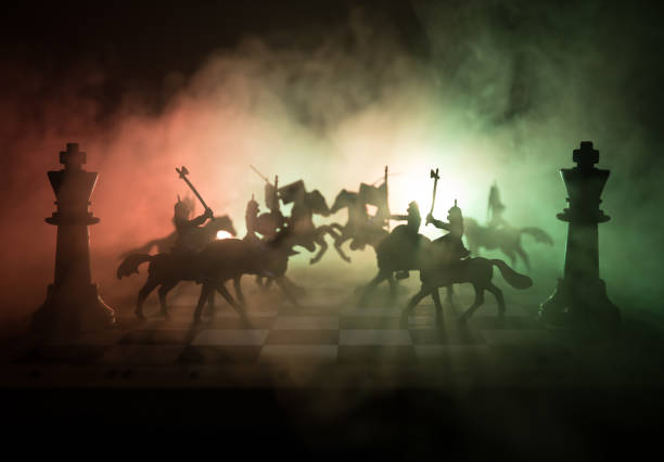 istock Medieval battle scene with cavalry and infantry on chessboard. Chess board game concept of business ideas and competition and strategy ideas Chess figures on a dark background. Selective focus 924589630