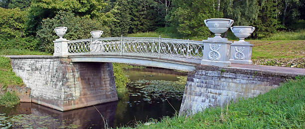 Stone bridge across small river stock photo