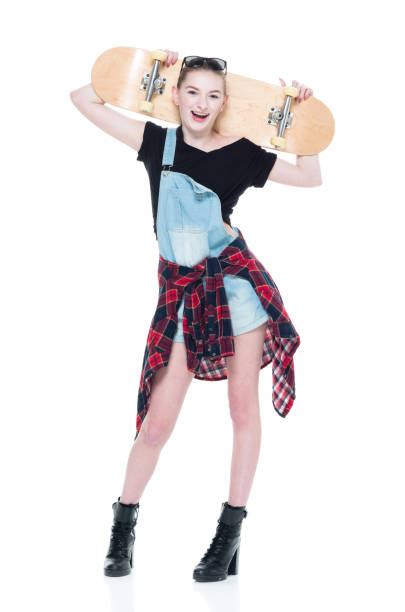 istock Young teenager with attitude holding skateboard 924593196