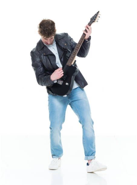 istock Handsome young male playing an electric guitar 924593370
