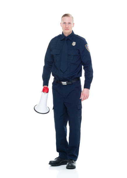 istock Handsome and friendly police officer using a megaphone 924597272