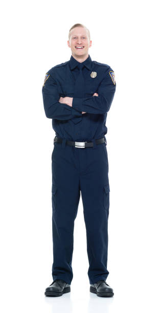 istock Handsome and friendly looking policeman with arms crossed 924603630