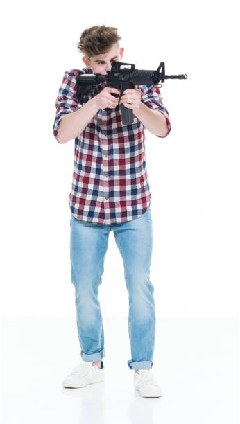 istock Teenager with assault rifle 924603636
