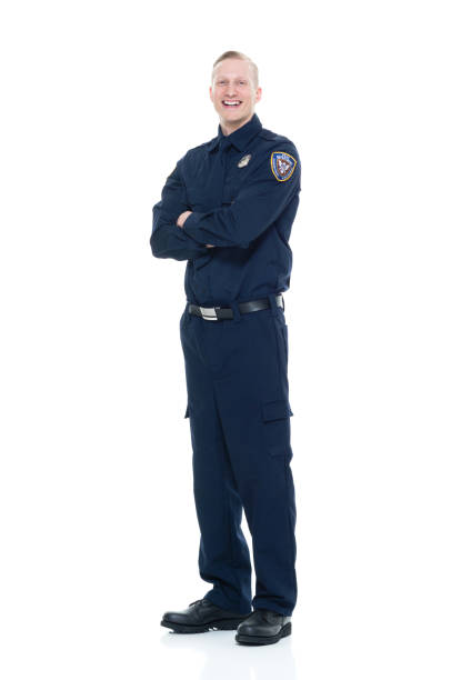 istock Handsome and friendly looking policeman with arms crossed 924603644