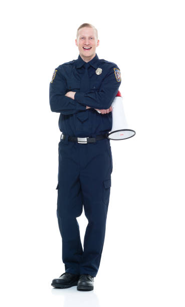 istock Handsome and friendly police officer using a megaphone 924603648
