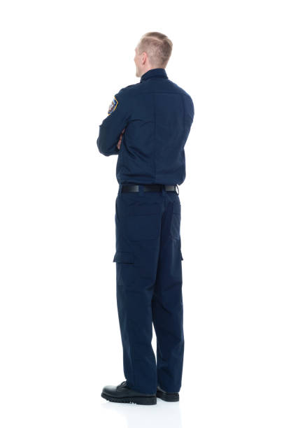 istock Handsome and friendly looking policeman with arms crossed 924609058