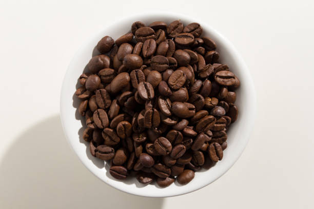 istock Close-Up Of Coffee Beans In Bowl Against White Background 924610068
