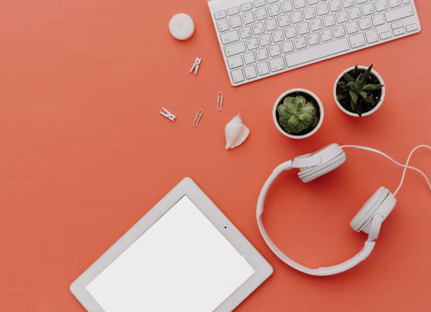 istock Blogger or freelancer workspace with tablet, headphones and accessories on pastel background. Mock up, Flat lay, top view, minimalistic  styled home office desk. Blog concept. 924614424