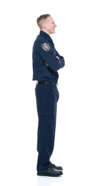 istock Handsome and friendly looking policeman with arms crossed 924615860