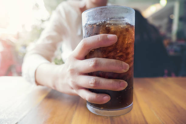 istock Midsection Of Woman Having Beer At Table 924617534