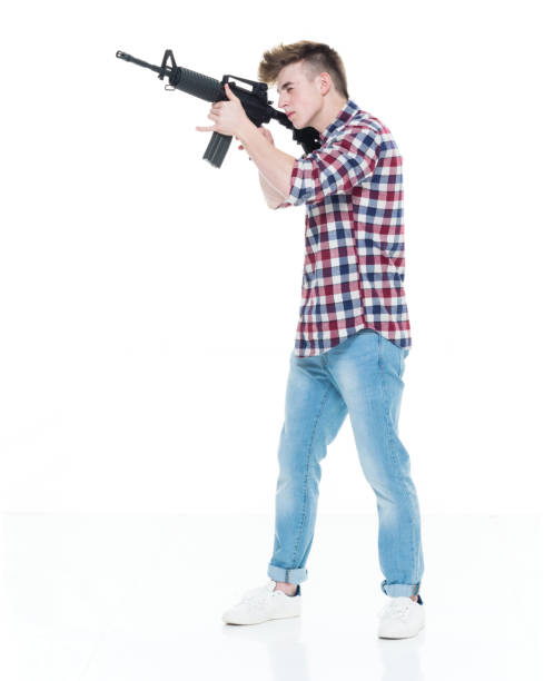 istock Teenager with assault rifle 924617694