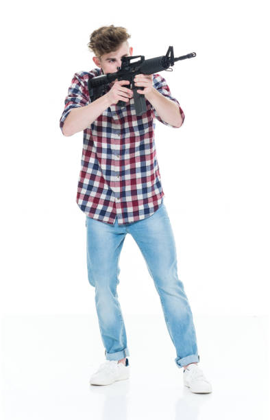istock Teenager with assault rifle 924617704