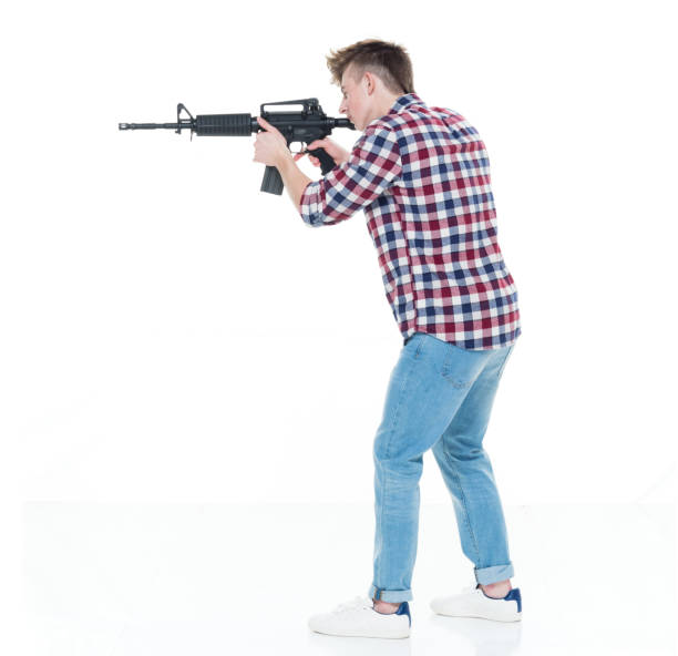istock Teenager with assault rifle 924617884