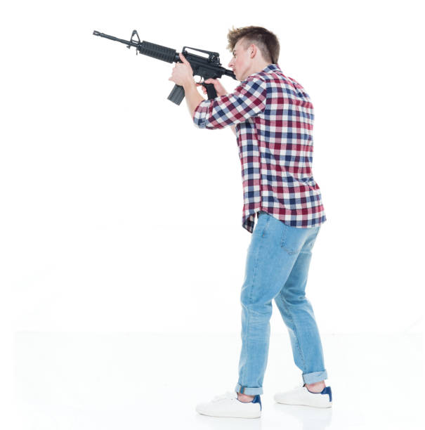 istock Teenager with assault rifle 924620594