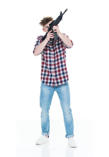 istock Teenager with assault rifle 924620614