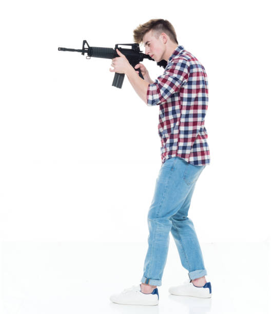 istock Teenager with assault rifle 924620620