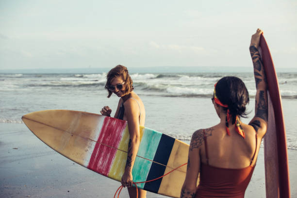 istock Women going surfing together 924620692