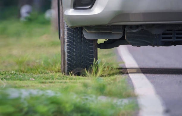 istock 4x4 SUV car parking on rural road shoulder 924620950