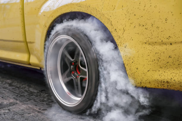 istock Drag racing car burn tire at start line 924621006