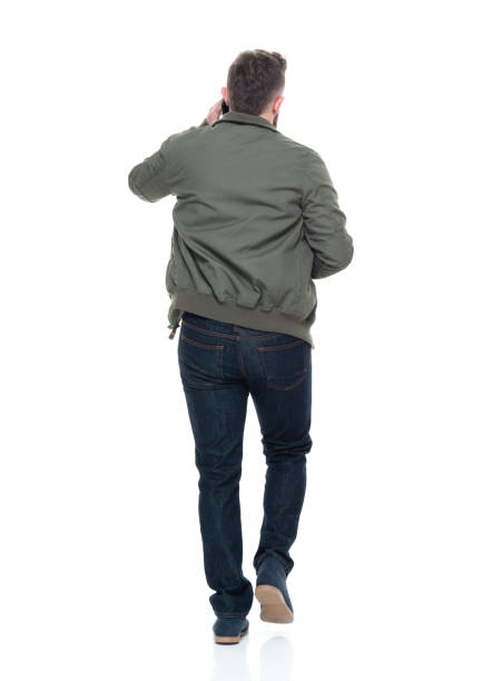 istock Cool guy with jacket and red shirt holding coffee and using smart phone 924627164