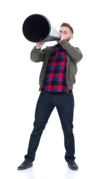 istock Interesting man in casual clothes using megaphone and being silly 924627206