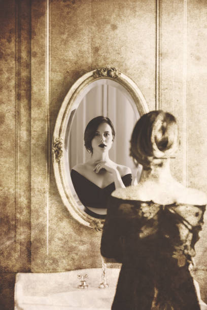 istock young woman looking at mirror 924627308