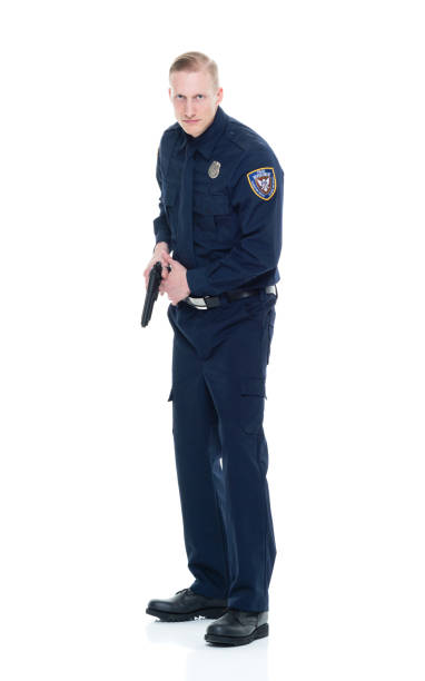 istock Handsome and friendly police officer aiming with a handgun 924627388