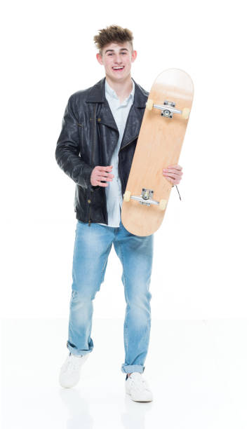 istock Handsome young teenager holding a skateboard 924628740