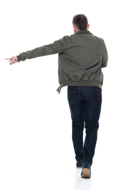 istock Man in bomber jacket and plaid shirt walking 924628760